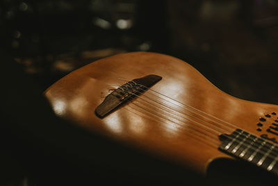 Close-up of guitar on table
