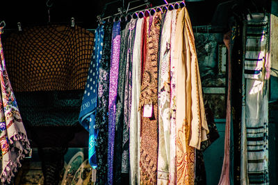 Multi colored flags hanging in store for sale at market stall