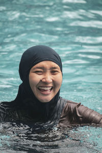 Young woman swimming in sea