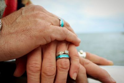 Couples hands on railing