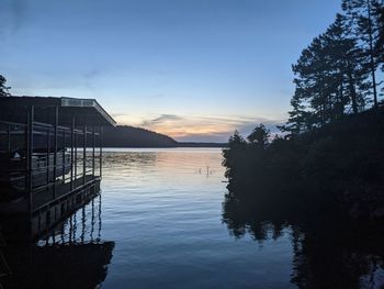 Scenic view of lake against sky during sunset