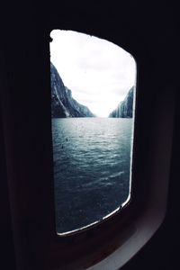 Scenic view of sea seen through glass window