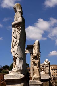 Low angle view of statue against sky