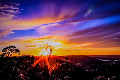 Scenic view of landscape against sky during sunset