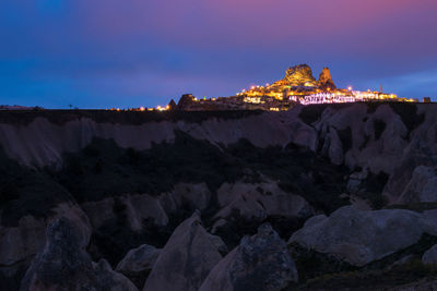 Low angle view of rock formations against sky