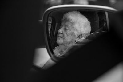 Midsection of man sitting in car