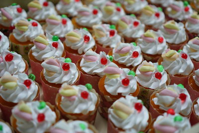 Close-up of cupcakes fancy on table against white background