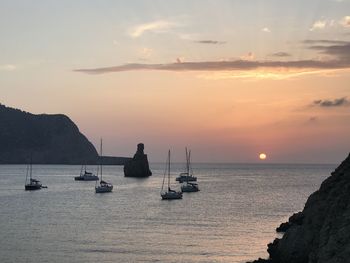 Sailboats in sea against sky during sunset in ibiza 