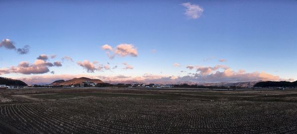 Scenic view of field against sky during sunset
