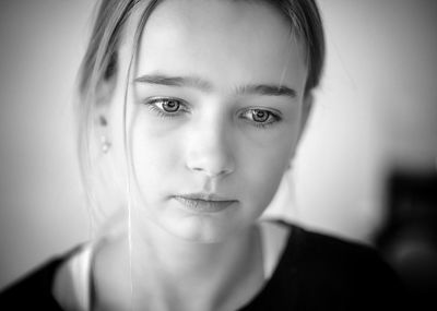 Close-up of thoughtful girl at home