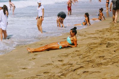 People enjoying on beach