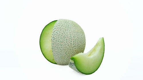 Close-up of fruit against white background
