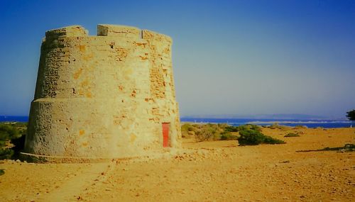 Scenic view of sea against clear blue sky