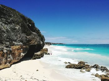 Scenic view of sea against clear blue sky