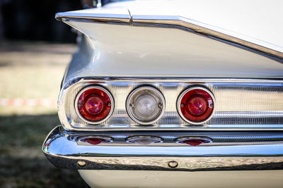 Close-up of taillight of vintage car during sunny day