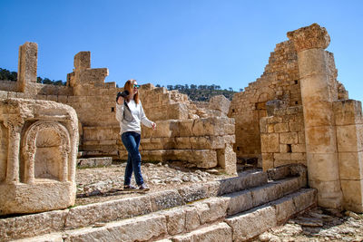 Full length of woman walking in old ruins