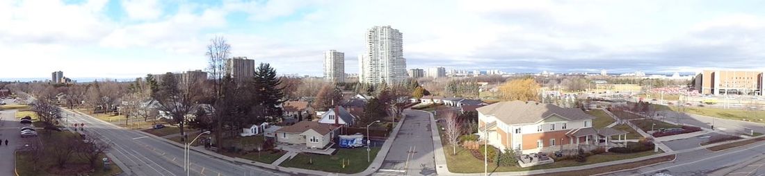 City street against cloudy sky
