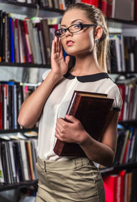 Young woman reading book