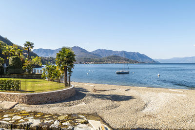 The colmegna coast in the lake maggiore with its beach and its villas