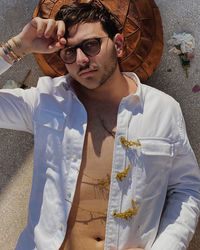 Portrait of young man wearing eyeglasses standing outdoors