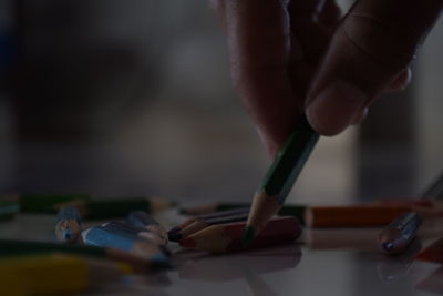 Close-up of hand holding pen