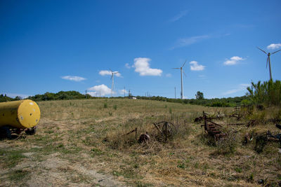 Scenic view of field against blue sky