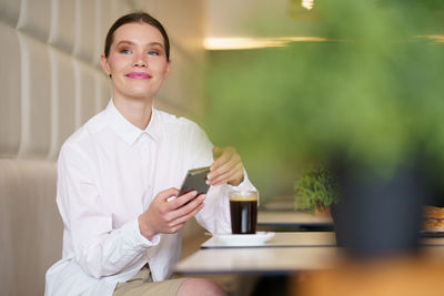 Young woman using mobile phone