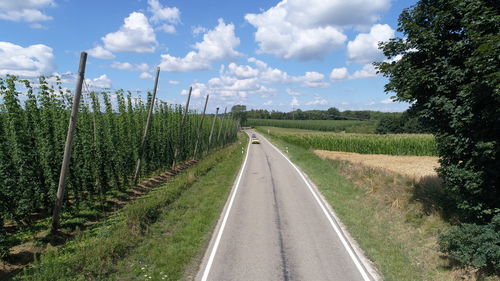 Panoramic view of agricultural field against sky