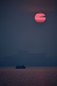Scenic view of sea against sky at sunset