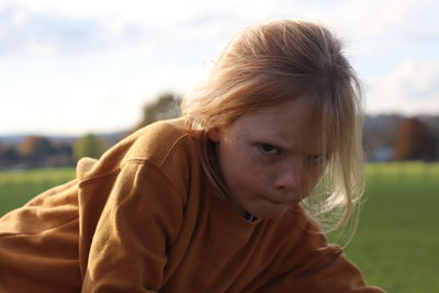 Portrait of girl against sky