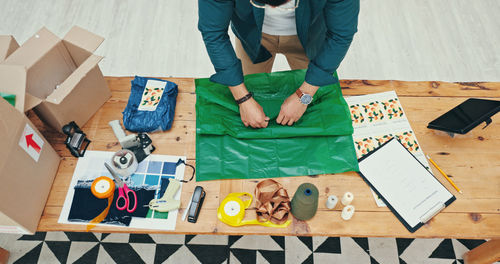 High angle view of people working on table