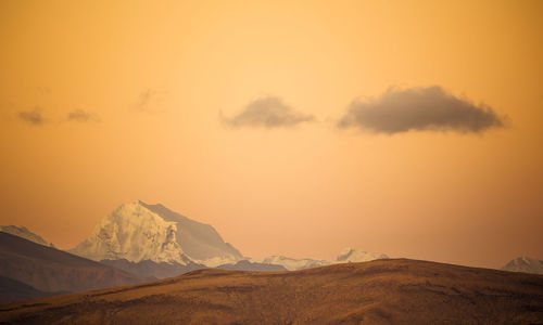 Scenic view of mountains against sky during sunset