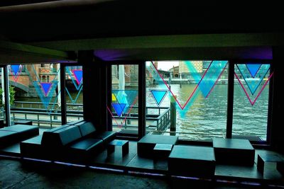 View of empty benches in the dark