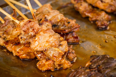 High angle view of meat on barbecue grill