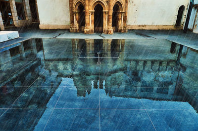 Digital composite image of swimming pool against building