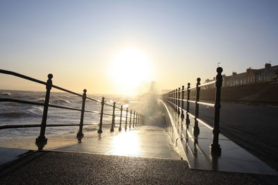 Scenic view of sea against clear sky during sunset