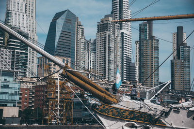 Modern buildings in city against sky