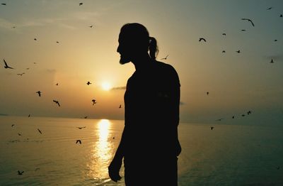 Silhouette of people at sunset