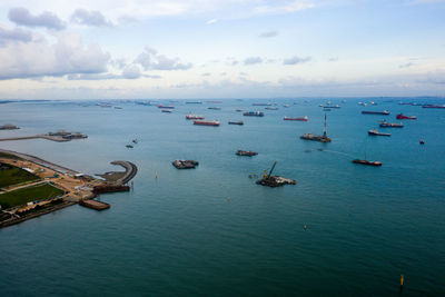 High angle view of sailboats in sea against sky