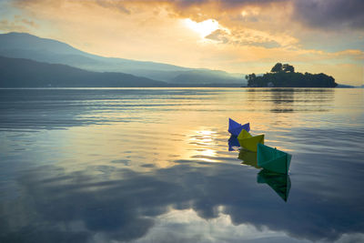 Scenic view of lake against sky during sunset