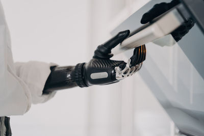 Cropped hand of scientist holding equipment