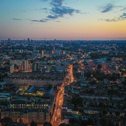 High angle view of city lit up at dusk