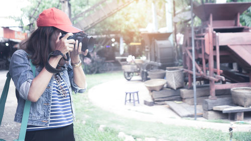 Woman photographing with camera