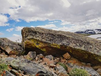 Low angle view of rock formation against sky