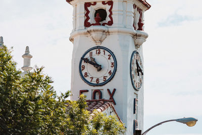 Low angle view of clock tower against sky