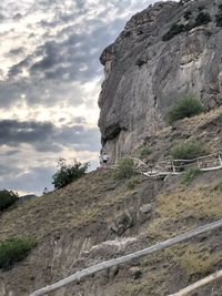 Rock formations on mountain against sky