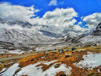 Aerial view of snowcapped mountains against sky- a fresh snowy morning