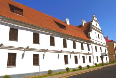 Low angle view of building against clear blue sky
