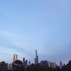 Buildings in city against sky