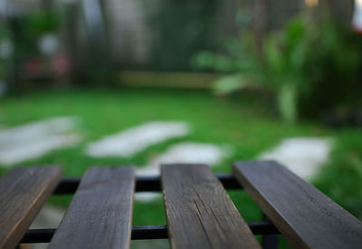 Close-up of bench in park